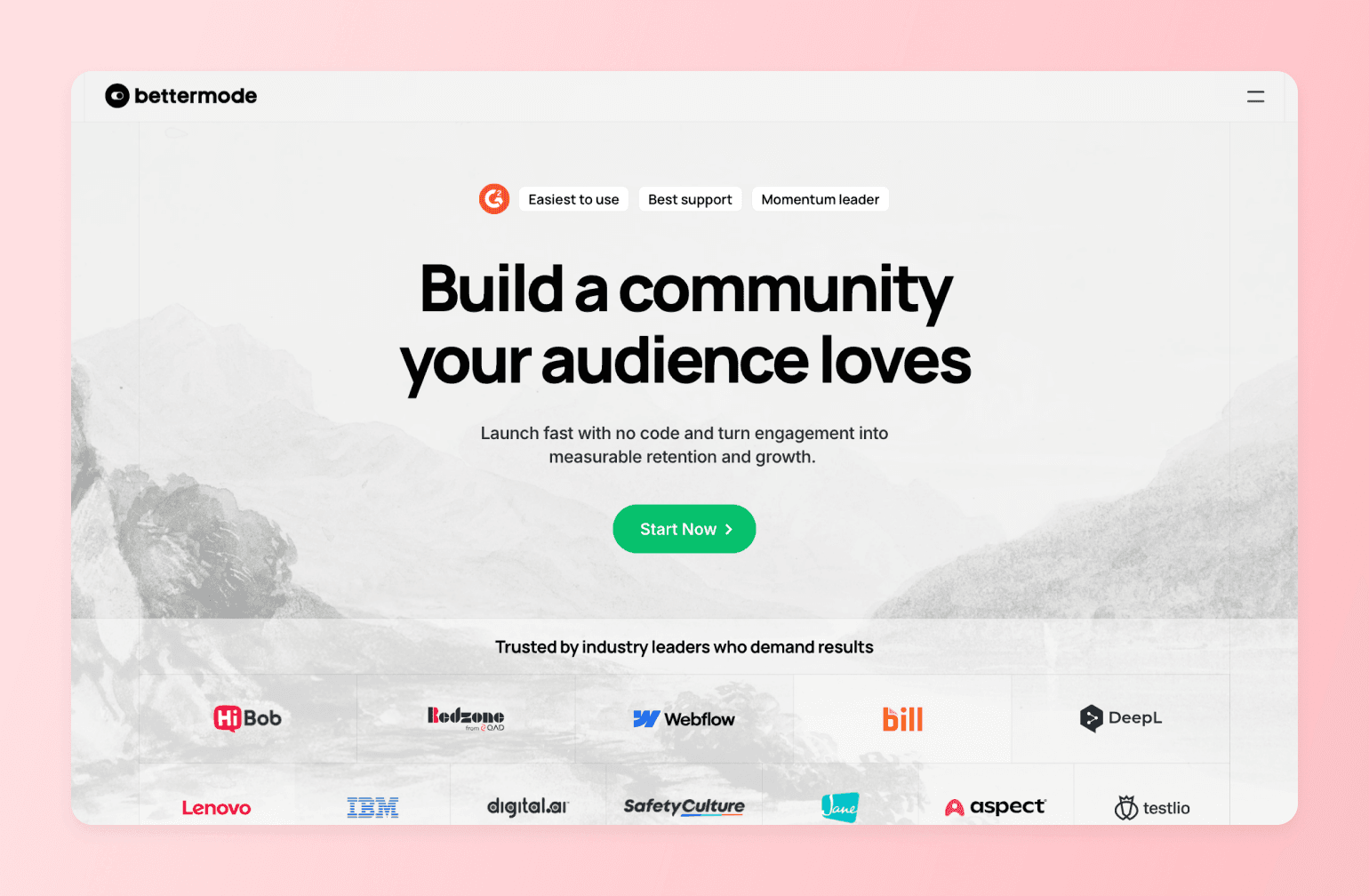 Bettermode landing page with headline "Build a community your audience loves" featuring logos of trusted companies like IBM, Lenovo, Webflow, and others against a mountain lake background