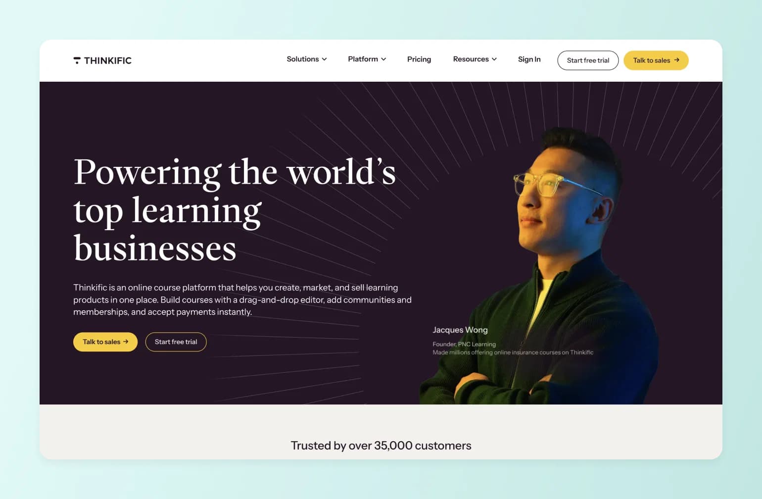 Thinkific online course platform homepage featuring Jacques Wong, Founder of PNC Learning, wearing yellow glasses against dark background with radiating lines