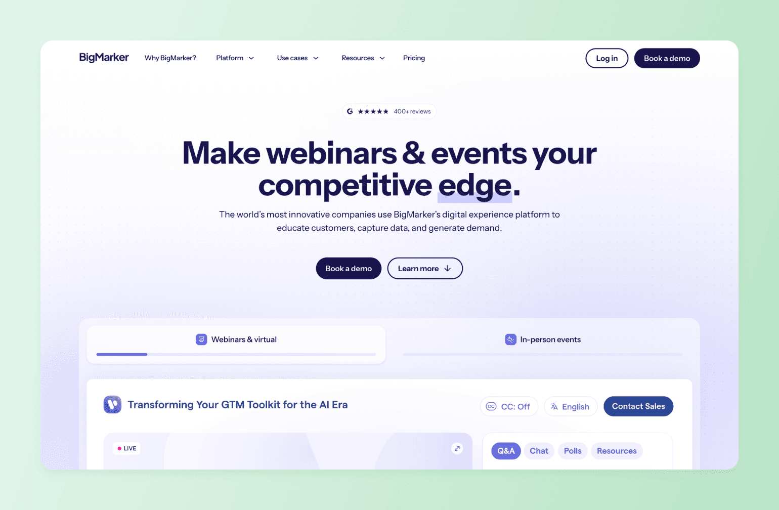 BigMarker webinar platform homepage showing headline and event interface with 400+ reviews, demo booking options, and live webinar preview